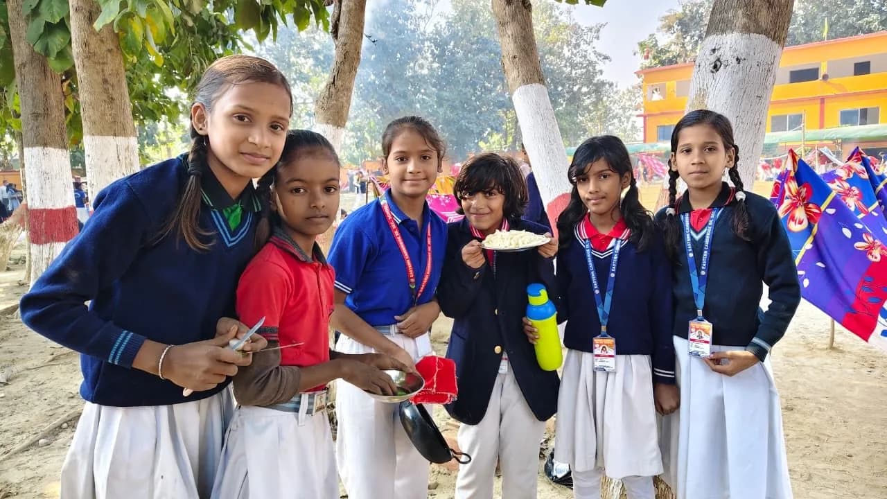 Scouts and guides cooking at camp