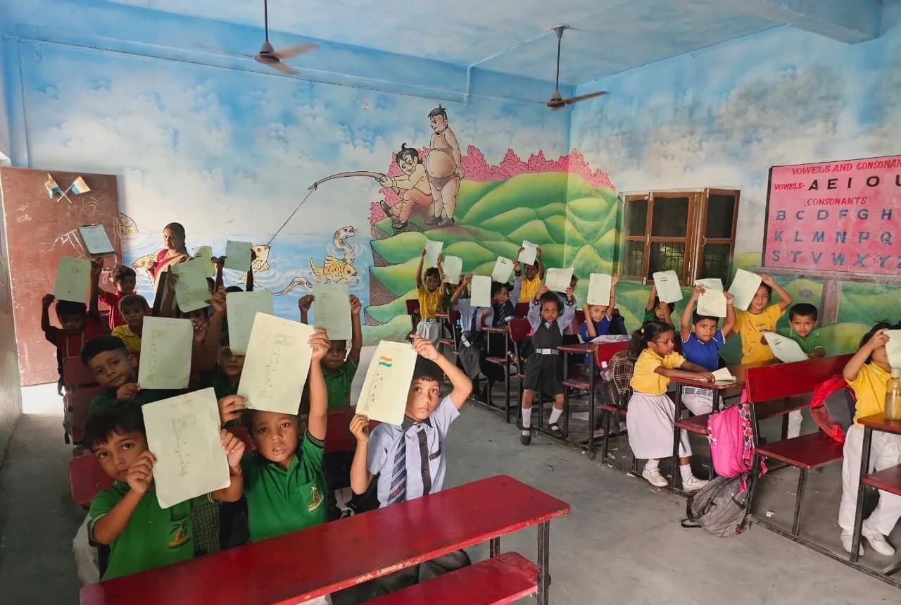Students showing their drawings in class